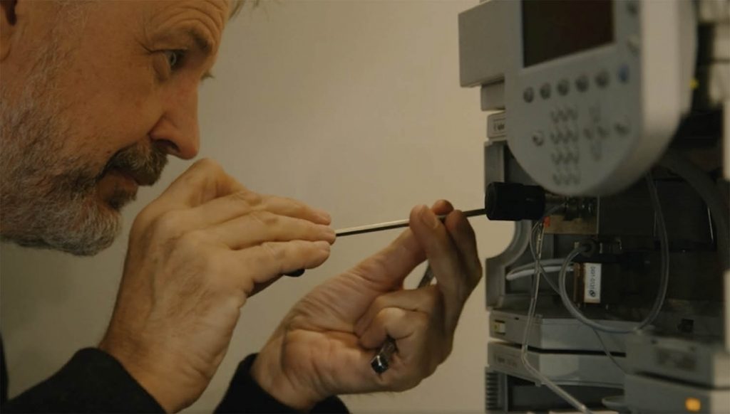 Our Expert Engineer Dave, tinkering with a HPLC System