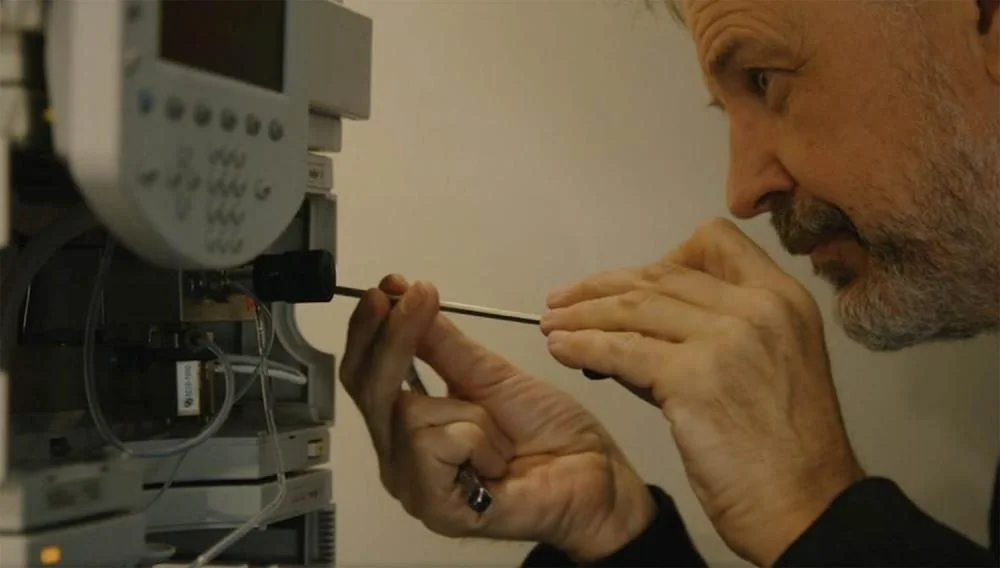 Our Expert Engineer Dave, tinkering with a HPLC System