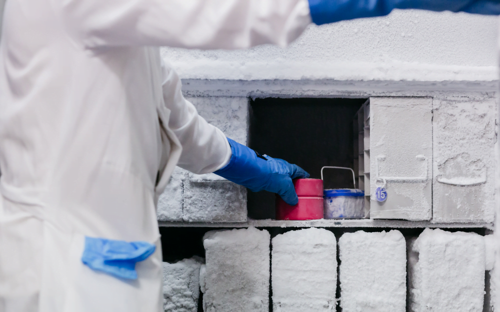 Scientist placing samples into a ULT freezer