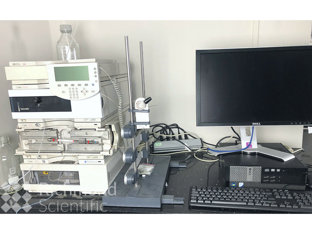 Agilent 1100 HPLC Basic system with manual injection and VWD, next to computer