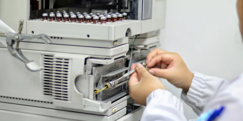 Scientist replacing HPLC column