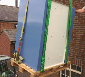 Fume cupboard being lifted using cherry picker