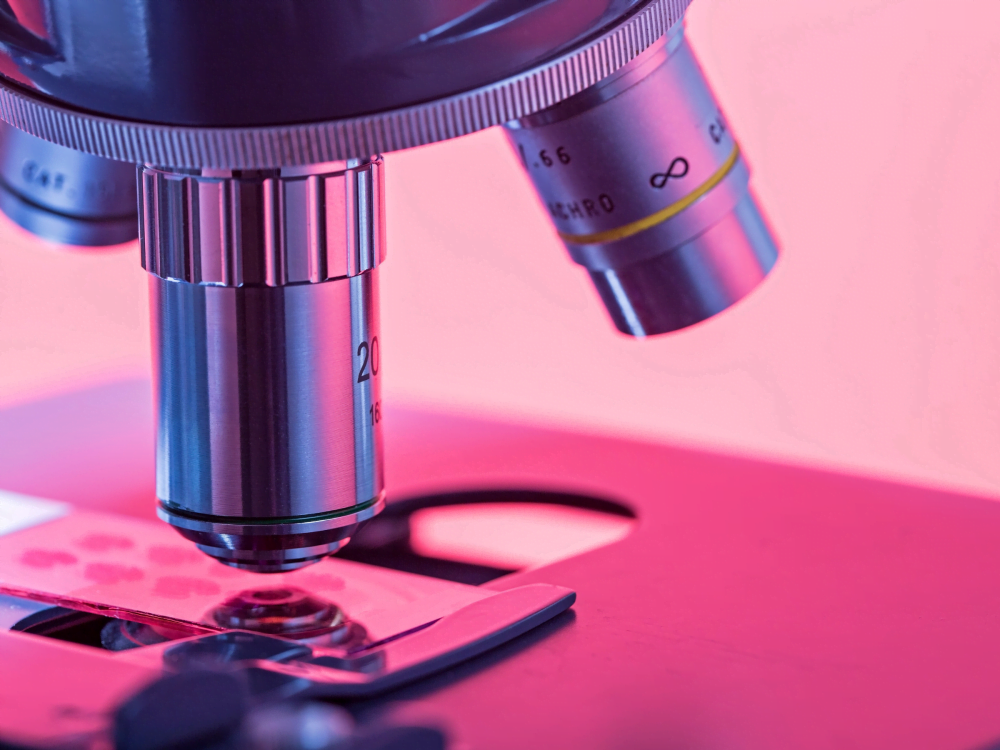 Close up on microscope objective. Stylised photograph