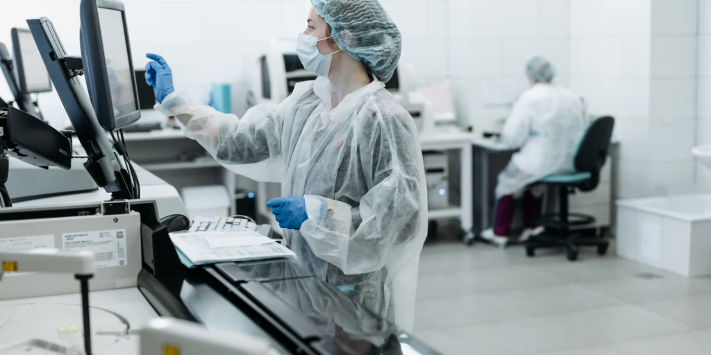 Scientist in lab using computer