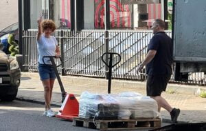 Stuart and Lisa from Richmond Scientific loading pallets of lab equipment in London